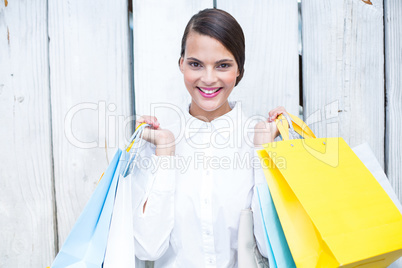 Beautiful brunette holding shopping bags