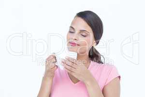 Beautiful woman smelling her coffee