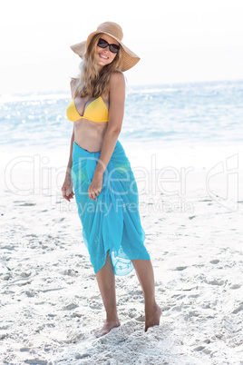 Smiling pretty blonde posing with sarong