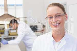 Happy scientist smiling at camera