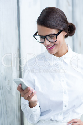 Pretty brunette using her smartphone