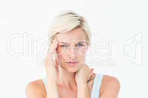 Blonde woman suffering from headache and neck ache