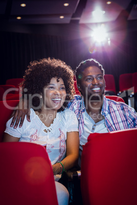 Young couple watching a film