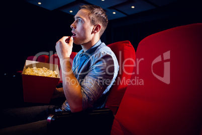 Young man watching a film