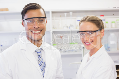 Scientists smiling and looking at camera