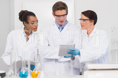 Scientists looking at clipboard
