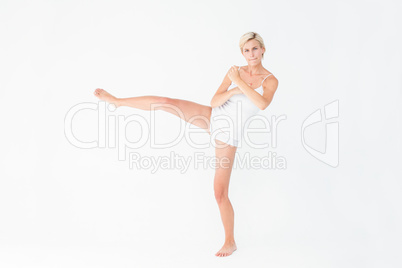 Pretty woman raising her leg
