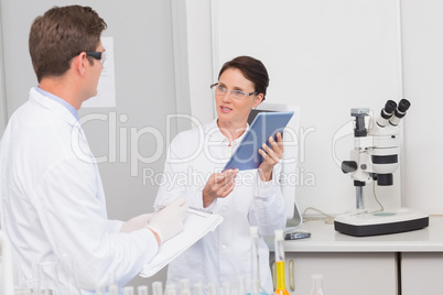 Smiling scientists talking to each other