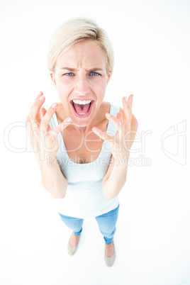 Upset woman yelling with hands up