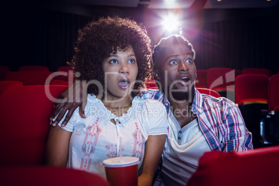 Young couple watching a film