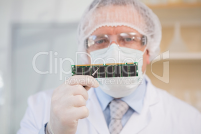 Engineer holding electronic card