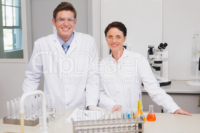 Scientists smiling and looking at camera Scientists smiling and looking at camera