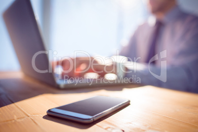 Businessman using laptop at desk