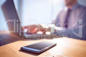 Businessman using laptop at desk