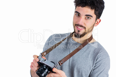 Casual man holding his camera