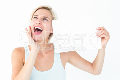 Happy blonde with poster screaming