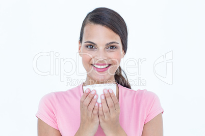 Pretty brunette drinking cup of coffee