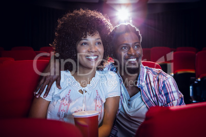 Young couple watching a film