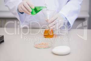 Scientist mixing precipitates