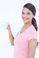 Pretty brunette holding coffee cup