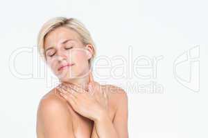 Peaceful woman touching her neck