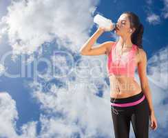 Composite image of beautiful healthy woman drinking water