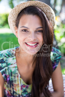 Smiling beautiful brunette lying on the blanket