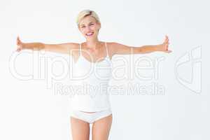 Happy woman smiling at camera with arms out