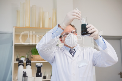 Scientist doing experimentations in flask