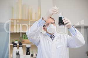 Scientist doing experimentations in flask