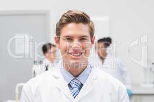 Happy scientist smiling at camera