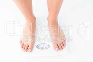 Woman standing on the scales