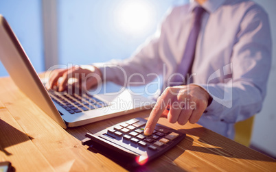 Businessman using laptop at desk