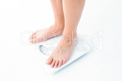 Woman standing on the scales