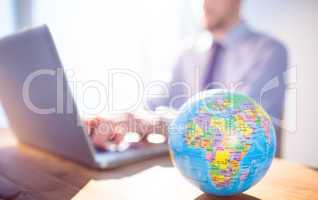 Businessman using laptop at desk