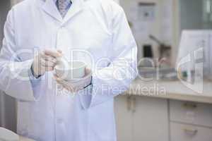 Scientist grinding powder with mortar