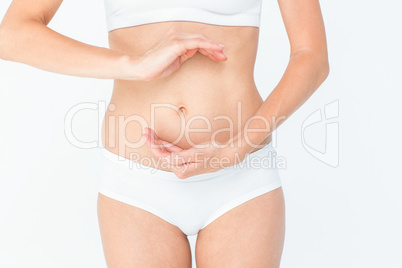 Woman with hands on belly