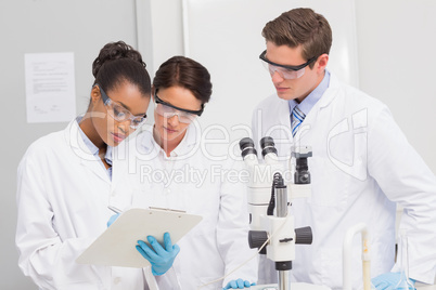 Scientists taking notes