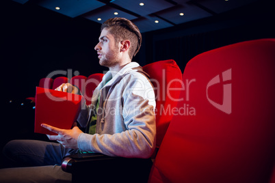 Young man watching a film Young man watching a film