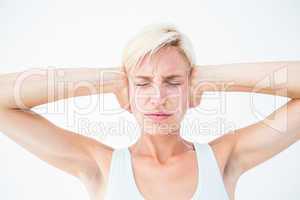 Upset woman covering her ears