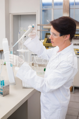 Scientist working attentively with test tube