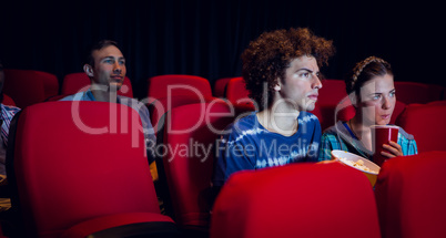 Young friends watching a film