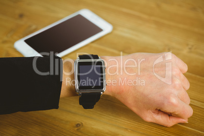 Businesswoman with smart watch on wrist