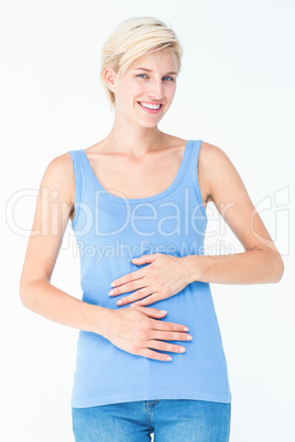 Happy woman touching her belly