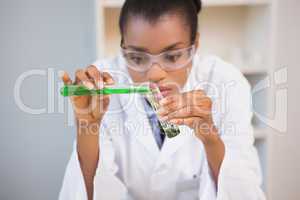 Concentrated scientist doing scientific experiment