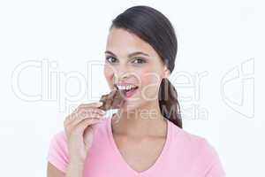 Beautiful woman eating chocolate