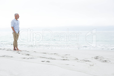 Thoughtful man standing by the sea