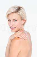 Attractive woman touching her shoulder