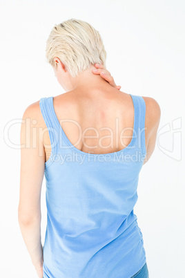 Casual woman suffering from neck ache