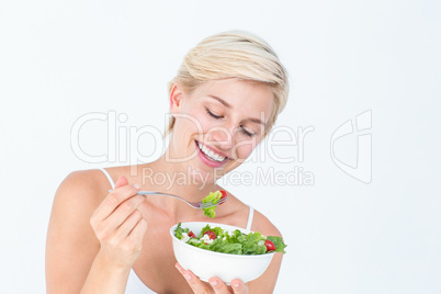 Beautiful blonde woman eating salad Beautiful blonde woman eating salad